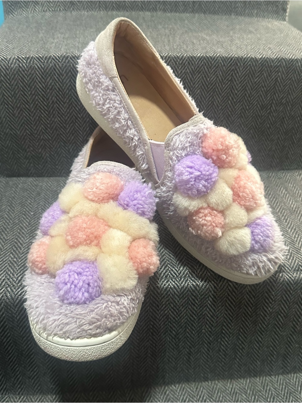UGG Silver Trim Fuzzy Slip-On Soles Visible